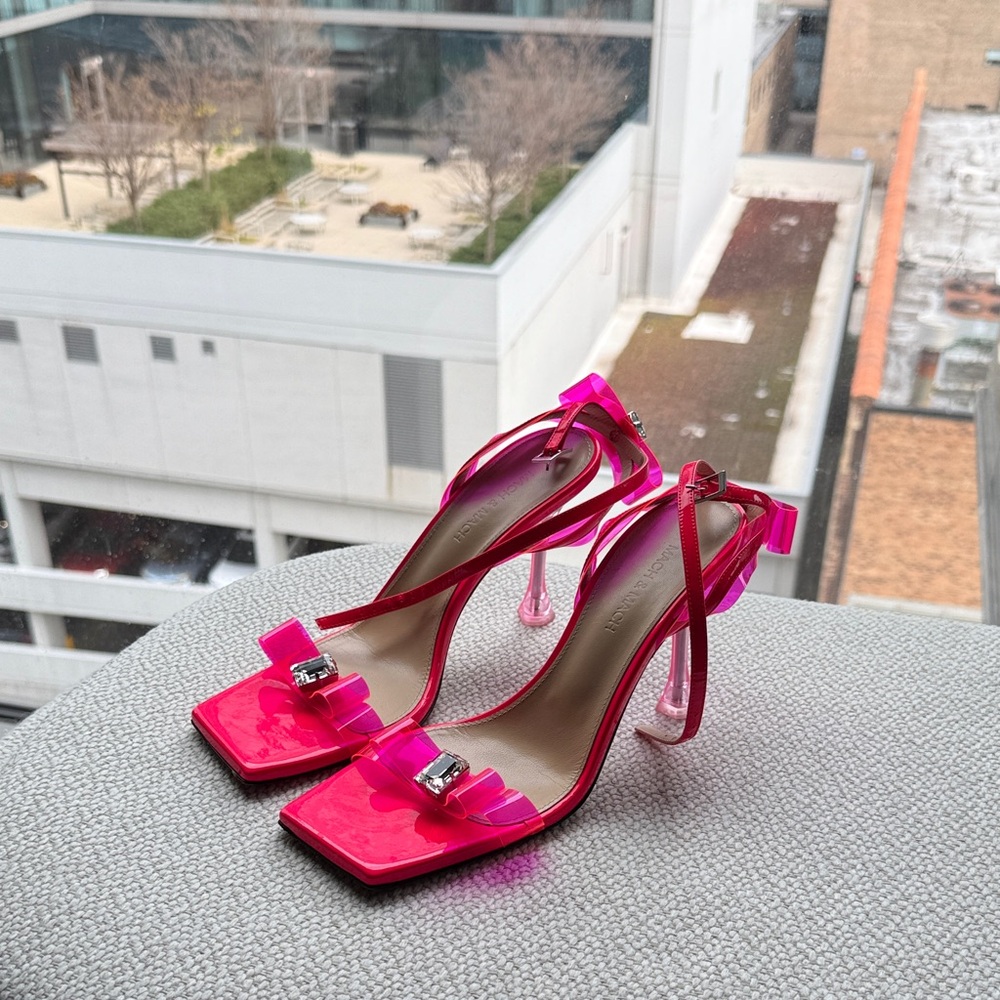 MACH & MACH vibrant pink heels with bow accent.